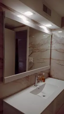 a bathroom with a sink and a mirror at Ocean Reserve in Sunny Isles Beach