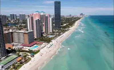 an aerial view of a beach and the ocean at Ocean Reserve in Sunny Isles Beach