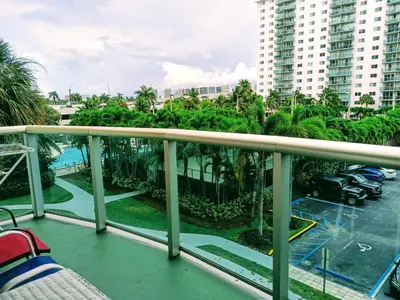 a balcony with a view of a resort at Ocean Reserve in Sunny Isles Beach