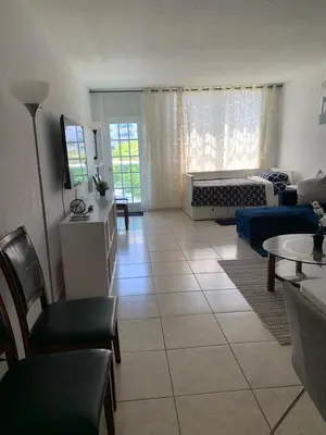 a living room with a large tile floor at Ocean Reserve in Sunny Isles Beach