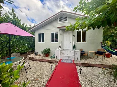 a house with a red pathway in front of it at Nice 2 Twin bedroom - Best central location in Miami - Luggage storage, parking and Laundry for free!!!! in Miami