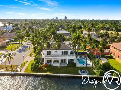 an aerial view of a house with palm trees at Villa wpool spa game room in Hollywood