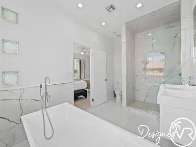 a white bathroom with a tub and a sink at Villa wpool spa game room in Hollywood