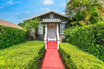 a house with a red carpet leading to a white door at Welcoming 2-BR apartment - 6 people V1 in Miami