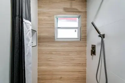 a bathroom with a shower and a window at Miami studio apartment, Very centric, Fast Wi-Fi V4 in Miami