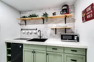 a kitchen with a sink and a microwave at Miami studio apartment, Very centric, Fast Wi-Fi V4 in Miami