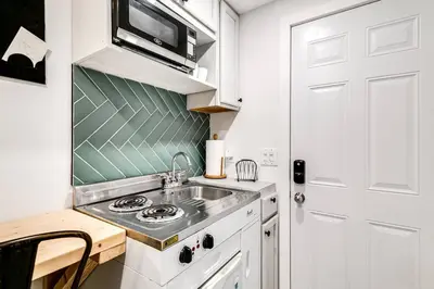 a small kitchen with a sink and a microwave at Wonderful Studio Cottage 2 people V5 in Miami