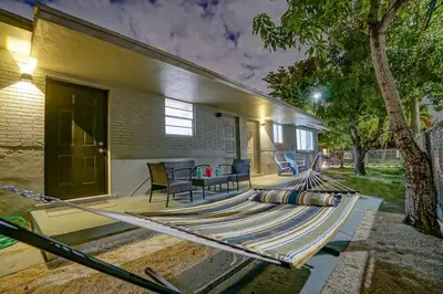 a house with a large rug on a patio at Wynwood Bungalow Hottub & Pking in Miami