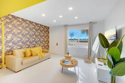 a living room with a couch and a table at Hollywood Broadwalk Haven - Free Parking in Hollywood