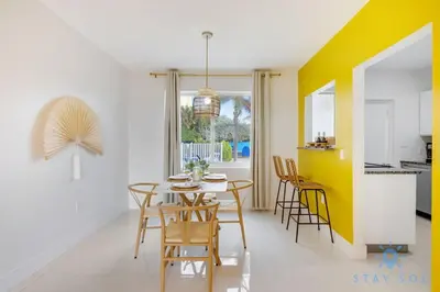 a kitchen and dining room with a table and chairs at Hollywood Broadwalk Haven - Free Parking in Hollywood