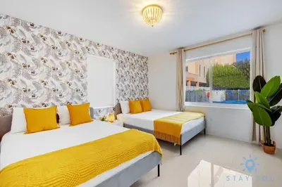 a bedroom with two beds and a window at Hollywood Broadwalk Haven - Free Parking in Hollywood