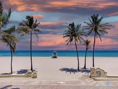 a beach with palm trees and a truck on it at Hollywood Broadwalk Haven - Free Parking in Hollywood