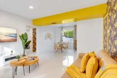 a living room with a couch and a table at Hollywood Broadwalk Haven - Free Parking in Hollywood