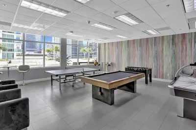 a room with two ping pong tables in it at Superb Private unit Perfectly Located In Brickell in Miami