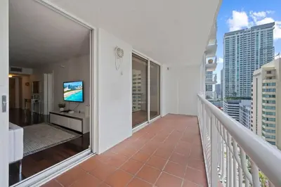 a balcony with a flat screen tv on it at Well Located Unit with parking - Heart Of Brickell in Miami