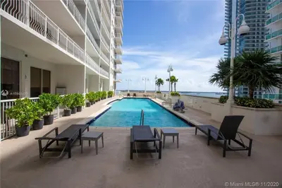 a swimming pool in the middle of a building at Well Located Unit with parking - Heart Of Brickell in Miami