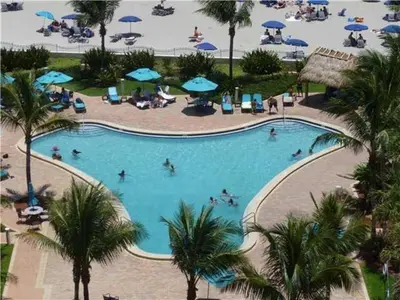 an overhead view of a swimming pool with people in it at Tides on Hollywood Beach in Hollywood