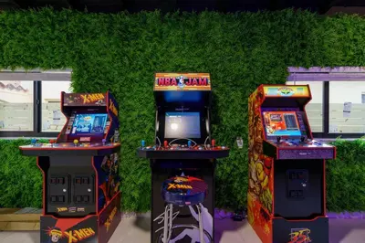 two arcade machines sitting next to each other at New Miami & Calle Ocho Home with Arcade! in Miami