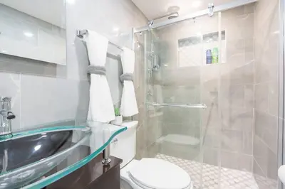 a bathroom with a shower and a toilet and a sink at New Miami & Calle Ocho Home with Arcade! in Miami