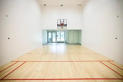 an empty gymnasium with a basketball hoop and a wooden floor at Breathtaking 35th Floor 1 BDR in Hyde Beach House in Hollywood