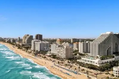 an aerial view of a beach with buildings and the ocean at WVR Vacation Residences 709 in Fort Lauderdale