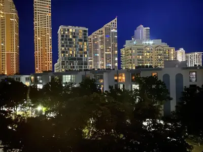 a view of a city skyline at night at Le Cartier Sunny Isles Ocean Paradise in Sunny Isles Beach