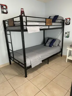 a couple of bunk beds in a room at Beds & Sheets DOWNTOWN in Miami