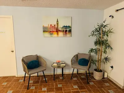 two chairs and a table in a room at Beds & Sheets DOWNTOWN in Miami