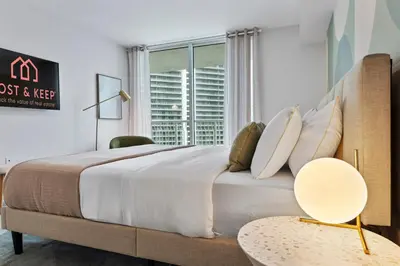 a bedroom with a large bed and a window at Cloud 9 - Amenities 24 7 Security & Location in Miami