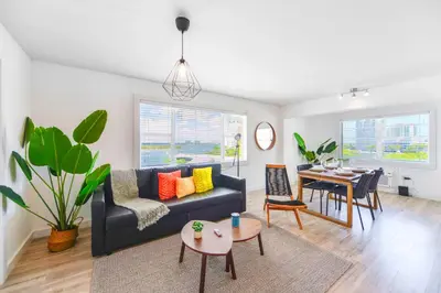 a living room with a couch and a table at Front Bay & Unique Stay for a Relaxing Experience in Miami Beach