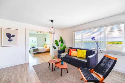a living room with a couch and a chair at Front Bay & Unique Stay for a Relaxing Experience in Miami Beach