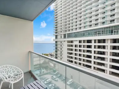 a balcony with a chair and a view of the ocean at Ocean View 1 bed Sian 11th floor Miami in Hollywood