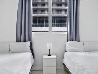 a bedroom with two beds and a window at Ocean View 1 bed Sian 11th floor Miami in Hollywood