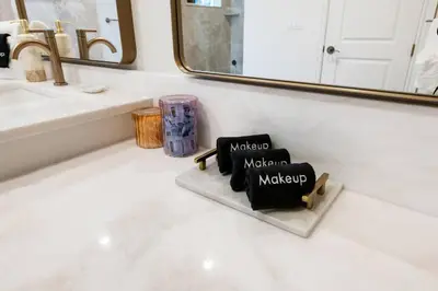 a bathroom with two black towels on a counter at The Betty A Glam Getaway in Fort Lauderdale in Fort Lauderdale