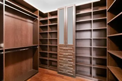 a walk in closet with wooden shelves at The Betty A Glam Getaway in Fort Lauderdale in Fort Lauderdale