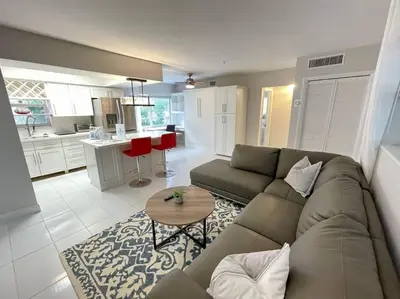 a living room with a couch and a table at Perfect Beach Escape 1BD/1Bath Close to Everything in Fort Lauderdale