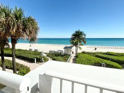 a view of the beach from the balcony of a condo at 5th Floor Luxury Suite at Trump Int Resort in Sunny Isles Beach