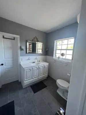 a bathroom with a white sink and a toilet at Villa Rustica 5 Bedroom 3 Bath with Pool Next to River 1800 in Miami