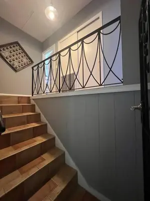 a set of stairs with a railing and a window at Villa Rustica 5 Bedroom 3 Bath with Pool Next to River 1800 in Miami