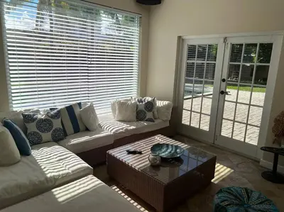a living room with a couch and a coffee table at Villa Rustica 5 Bedroom 3 Bath with Pool Next to River 1800 in Miami