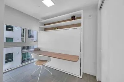 a white room with a desk and a chair at Breathtaking studio in the Heart Miami in Miami