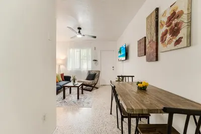 a living room with a table and a couch at Little Havana 1BR Apt w Parking in Miami
