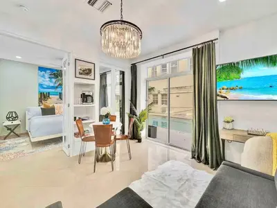 a living room with a couch and a table at Park Place South of Fifth in Miami Beach