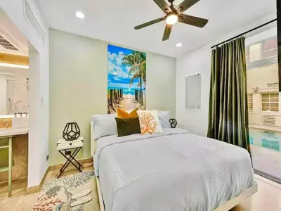 a bedroom with a bed and a ceiling fan at Park Place South of Fifth in Miami Beach