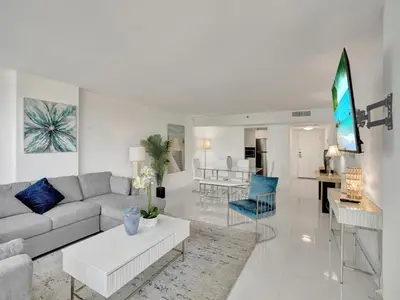 a living room with a couch and a table at Beautiful Beach Condo Beach Service 1020 in Miami Beach
