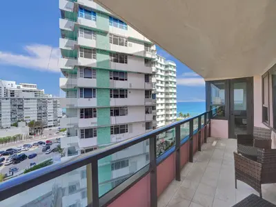 a balcony with a view of a building at Beautiful Beach Condo Beach Service 1020 in Miami Beach