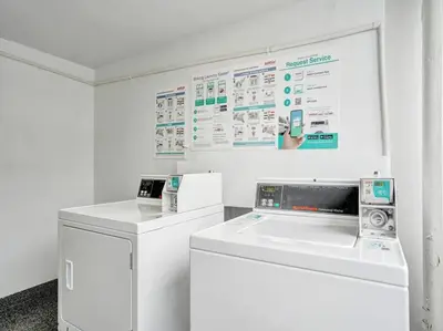 a white laundry room with a washer and dryer at Ocean Front Penthouse 2BD 2 Balconies PH-2 in Miami Beach