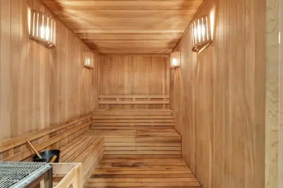 an empty sauna with wooden walls and wood flooring at Modern 1 Bedroom In The Heart Of Downtown Doral in Hialeah Gardens