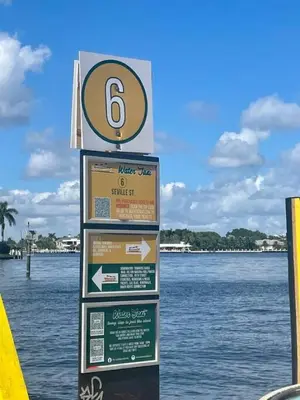 a sign on the side of a body of water at Bayshore Breeze Free Parking 1 in Fort Lauderdale