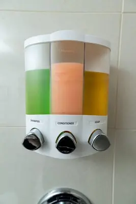 a soap dispenser on a wall above a sink at Bayshore Breeze Free Parking 3 in Fort Lauderdale